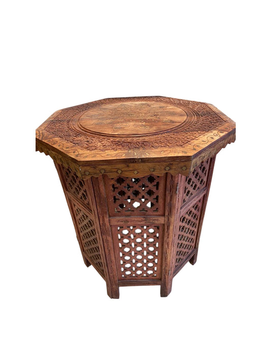 Wooden table with metall ornament